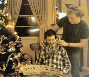 Jack helps Jim apply his disguise as they ready themselves for a Bar Mitzvah.